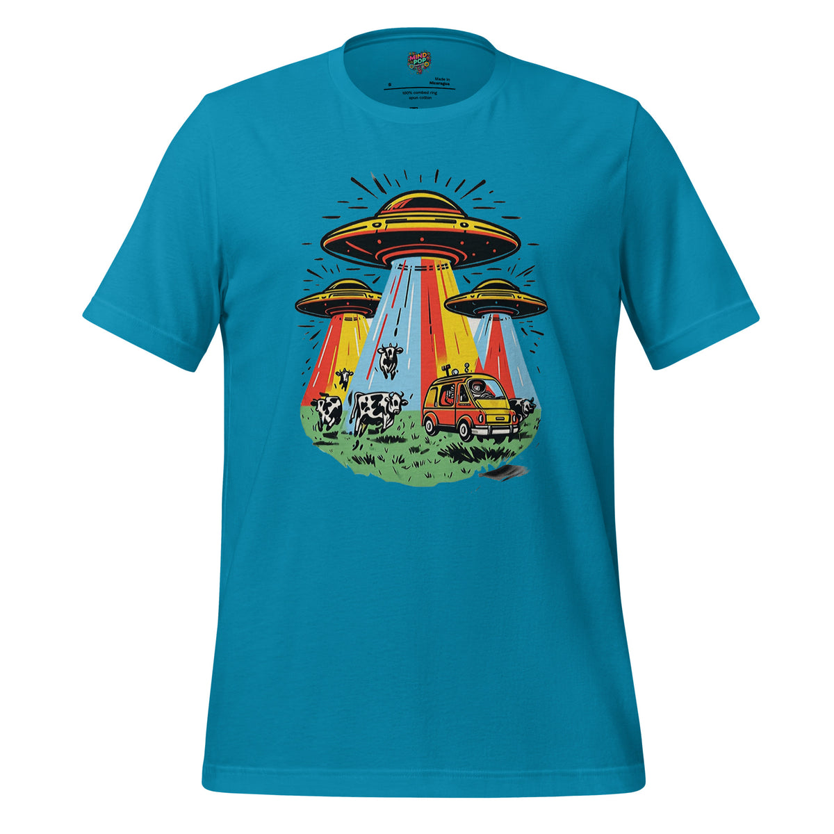 A bright turquoise blue short-sleeve t-shirt with a colorful retro graphic of three UFOs, glowing beams of light, a yellow car, and cows on a grassy field, shown against a plain white background.