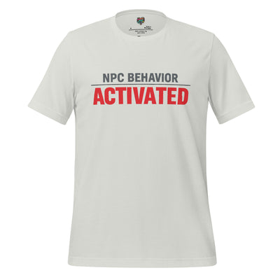 A light gray crewneck t-shirt featuring the text 'NPC BEHAVIOR' in dark gray and 'ACTIVATED' in bold red across the chest, displayed on a clean white background.