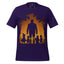 A dark purple short-sleeve t-shirt with a Halloween-themed graphic print on the front. The graphic features a silhouette of a man and children against an orange and yellow autumn tree background.