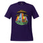 A dark purple short-sleeve crewneck t-shirt featuring a colorful retro graphic of UFOs, cowboys, and a station wagon under rainbow beams of light.