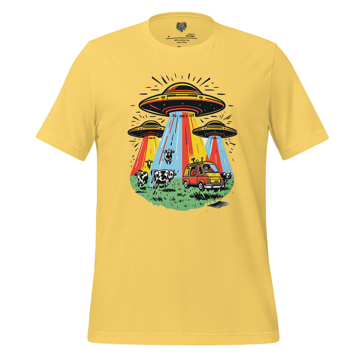 A yellow short-sleeve crewneck t-shirt featuring a colorful retro graphic of three UFOs with beams of light, a red car, and cows on a grassy field.