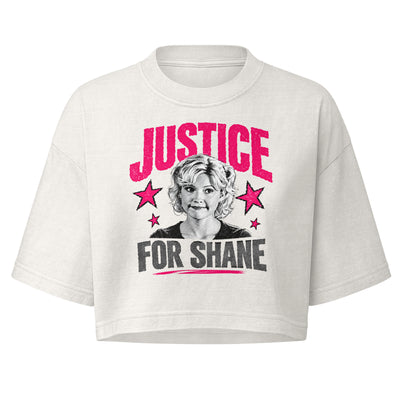 A white cropped t-shirt featuring a graphic print of a woman's portrait with the text 'JUSTICE FOR SHANE' in pink and black, accented by pink stars. Jessica Kiper